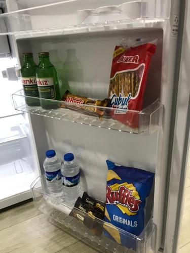 an open refrigerator filled with food and drinks at Senturkler Suite in Trabzon