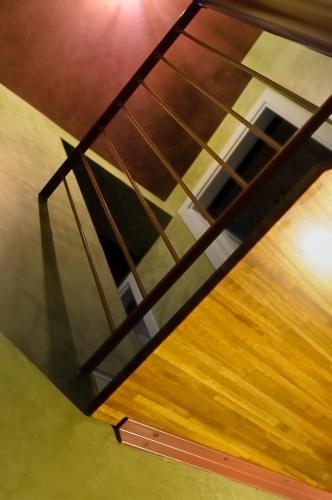 an overhead view of a glass table with a wooden floor at Relais B in Ancona