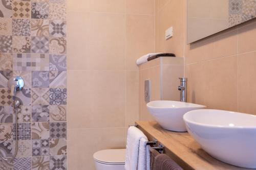 a bathroom with a sink and a toilet at Villa Zarra in Klimno