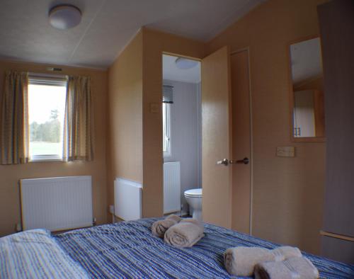 Postel nebo postele na pokoji v ubytování Chapel View Caravans