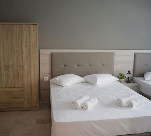 Una cama o camas en una habitación de Enjoy Apartments & Studios