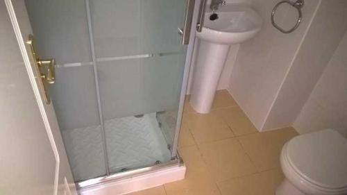 a bathroom with a shower and a toilet and a sink at Casaberian Manilva Beach Estepona, Marbella, Malaga, SPAIN in Manilva