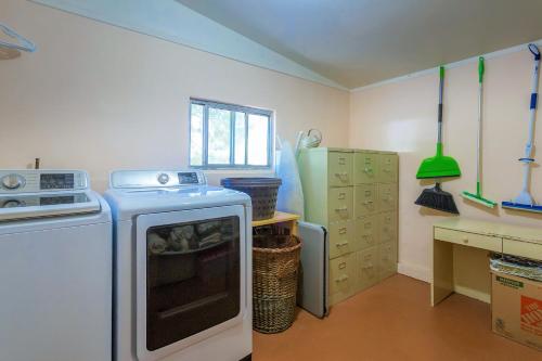 a small kitchen with a stove and a sink at Bright & Sunny Home Near Zion in Hurricane