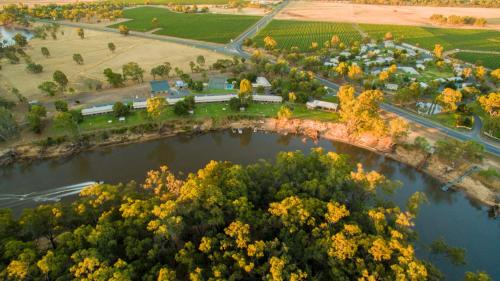 an aerial view of a park next to a river at Cadell On The Murray Motel in Moama