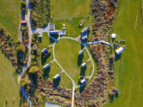 an overhead view of a park with cars parked at Appleby House & Rabbit Island Huts in Mapua