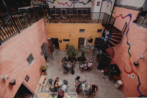 
people sitting around a building at Way Kap Hostel Arequipa in Arequipa
