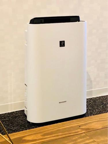 a white refrigerator sitting on top of a counter at FUKUOKA MOJIKO STAY in Kitakyushu