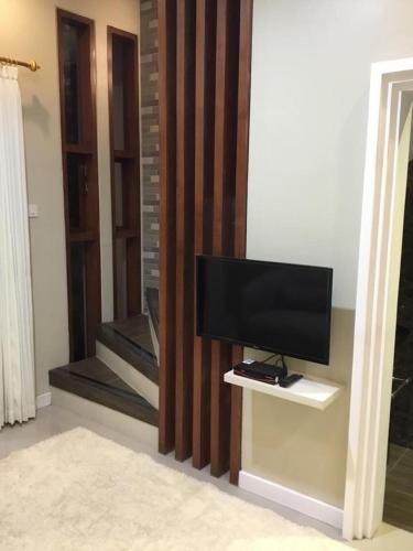 a television sitting on a shelf in a room at The Villa's Kubu Sandan in Kintamani