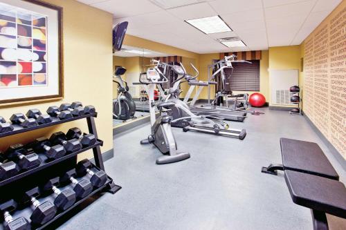 a fitness room with treadmills and exercise bikes at La Quinta by Wyndham Warner Robins - Robins AFB in Warner Robins