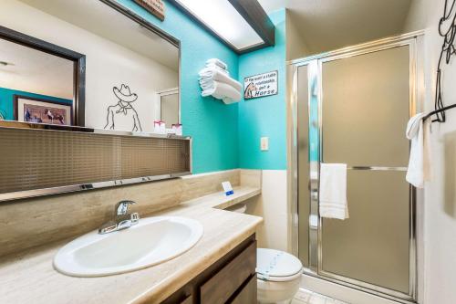 a bathroom with a sink and a shower at Rodeway Inn & Suites Big Water - Antelope Canyon in Big Water