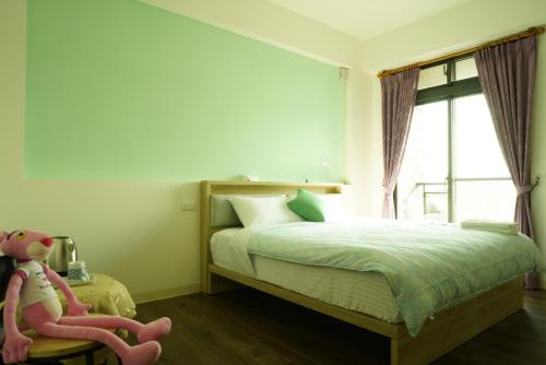 Postel nebo postele na pokoji v ubytování TiAmo B&B Yilan
