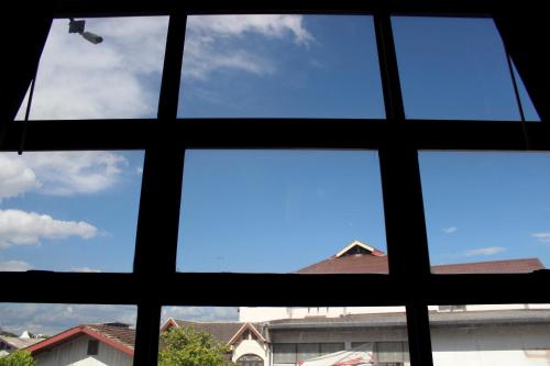 a view from a window of a blue sky at 3 Laan House in Chiang Mai
