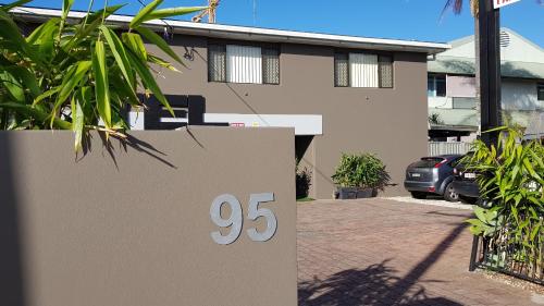 a house with a sale sign in front of it at Gold Coast Airport Motel - Only 300 Meters To Airport Terminal in Gold Coast