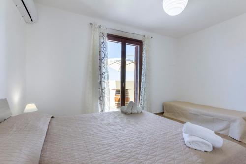 
A bed or beds in a room at Vento di Tramontana

