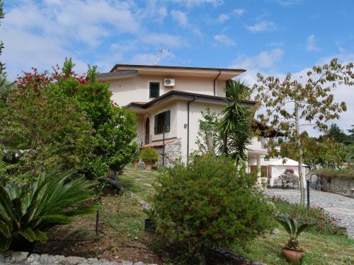 a white house with trees in front of it at B & B Korello in Gasponi