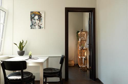 a dining room with a table and chairs at Greenhouse Apartments in Jūrmala