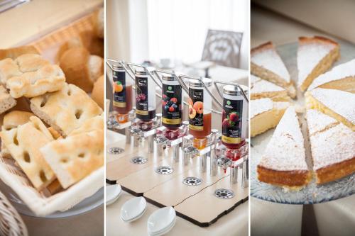 a table topped with different types of food and drinks at Hotel Virginia in Diano Marina