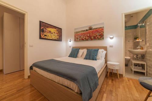 מיטה או מיטות בחדר ב-CS Termini Nazionale Apartments