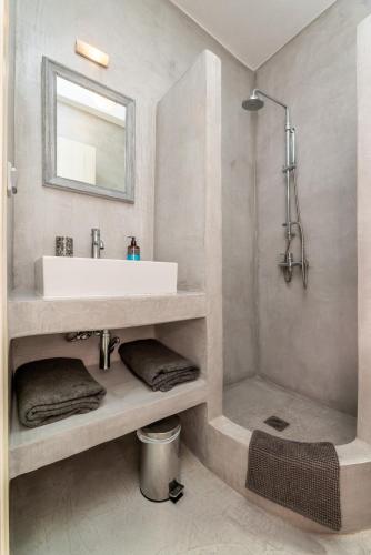 a bathroom with a sink and a shower at Agrikea in Korissia