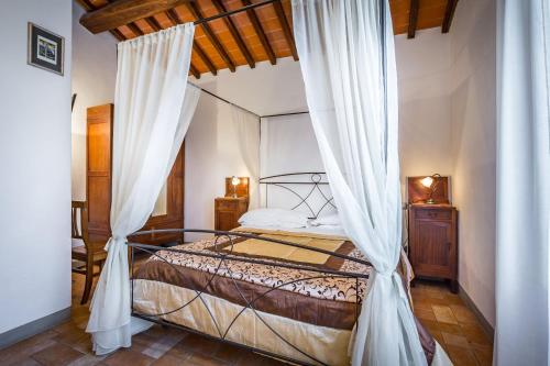 מיטה או מיטות בחדר ב-Agriturismo Poggiacolle