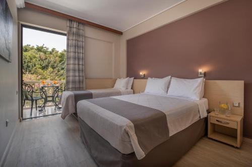 Postel nebo postele na pokoji v ubytování Acropolis View Hotel