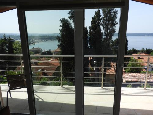 a view from the window of a house at Red Rose Apartment in Portorož