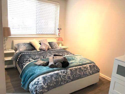 a bedroom with a bed with a teddy bear on it at 1 Bedroom Unit in Heart of Elsternwick in Melbourne