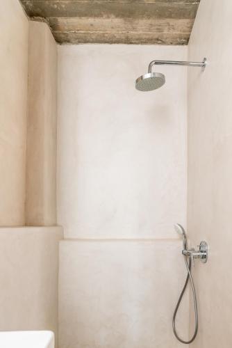 a bathroom with a shower with a shower head at Agrikea in Korissia
