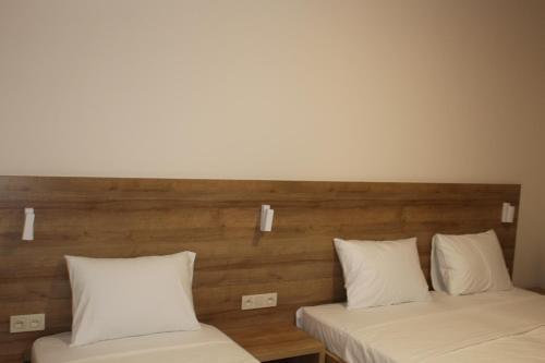 two beds sitting next to each other in a room at Boutique Hotel 32 in Batumi