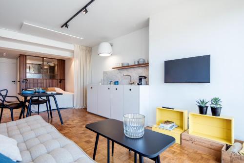 a living room with a couch and a table at knokkeappart Studio 2 pers in Knokke-Heist