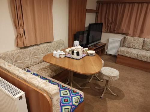 Χώρος καθιστικού στο Caledonian Caravan