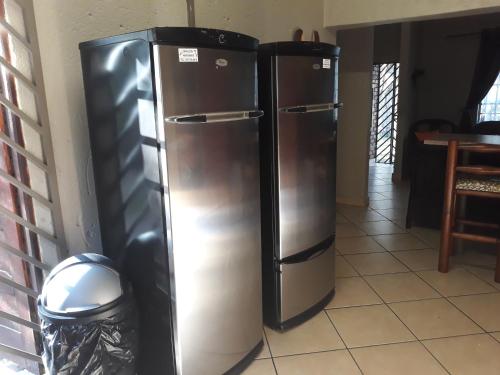 two stainless steel refrigerators are in a kitchen at Bellamia in Marloth Park