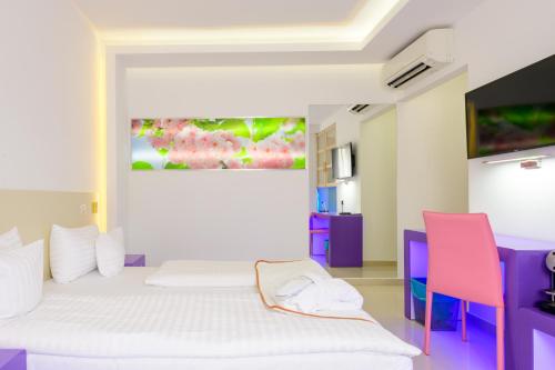 Postel nebo postele na pokoji v ubytování Hotel Christina Plus