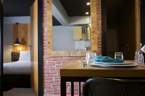 Postel nebo postele na pokoji v ubytování Suite Loc Suite & Spa