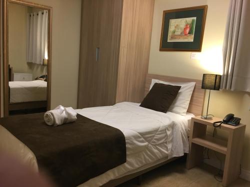 Ένα ή περισσότερα κρεβάτια σε δωμάτιο στο Hotel Praça da Matriz