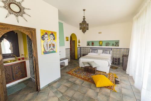 a bedroom with a bed and a bathroom at Attico rooms in Giardini Naxos