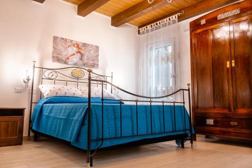 Ένα ή περισσότερα κρεβάτια σε δωμάτιο στο La Casa di Santino