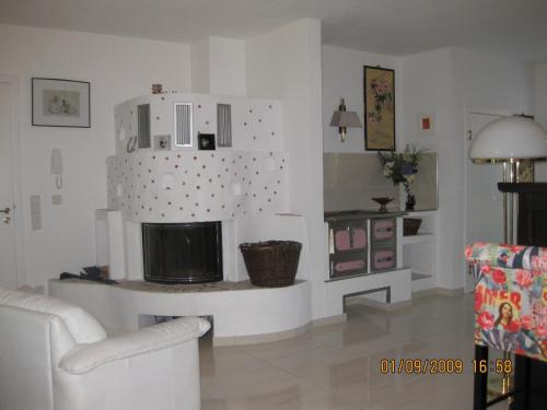 a living room with a tv in the corner of a room at Chalet Valley in Valley