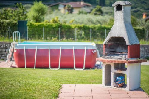a small bird feeder in front of a pool at Agriturismo Trefrutti in Arco