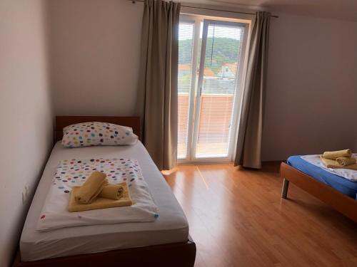 Postel nebo postele na pokoji v ubytování Apartment Laura