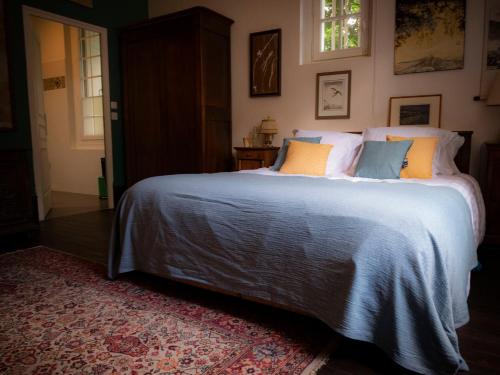 Giường trong phòng chung tại Bed & Breakfast - La closerie de la Fuye