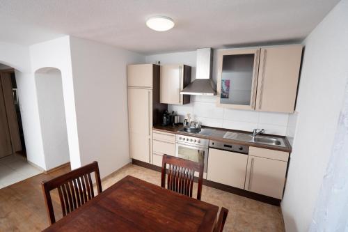 Kuchyň nebo kuchyňský kout v ubytování Hotel Bären