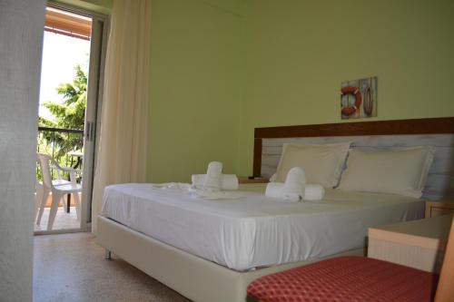 Ένα ή περισσότερα κρεβάτια σε δωμάτιο στο Apartments Dimitra