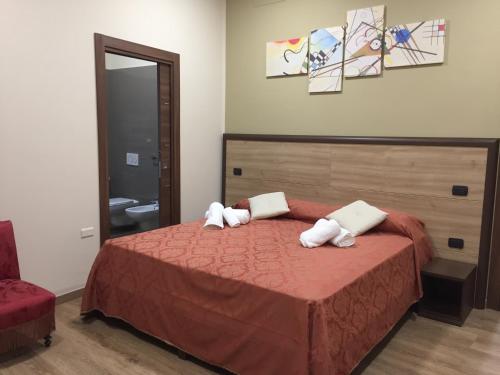 Voodi või voodid majutusasutuse B&B Duomo Apartament toas