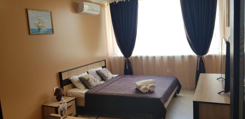 Ένα ή περισσότερα κρεβάτια σε δωμάτιο στο 7 DAYS Apartments Апартаменты в Затоке