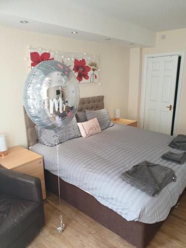 a bedroom with a bed with a large balloon at The Winter Garden Suites in Blackpool