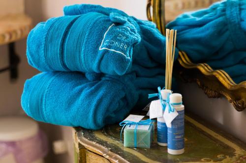 a pile of blue towels sitting on top of a table at Casa Rana in Recanati