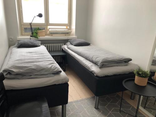 Un ou plusieurs lits dans un hébergement de l'établissement Scandinavian Sweet home 18 Heart of City