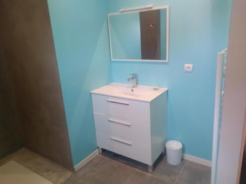 a bathroom with a sink and a mirror at gite de Jade in Montaigu-de-Quercy