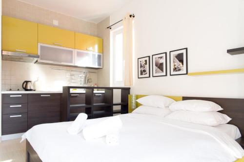 Alessandra Apartmentsにあるベッド